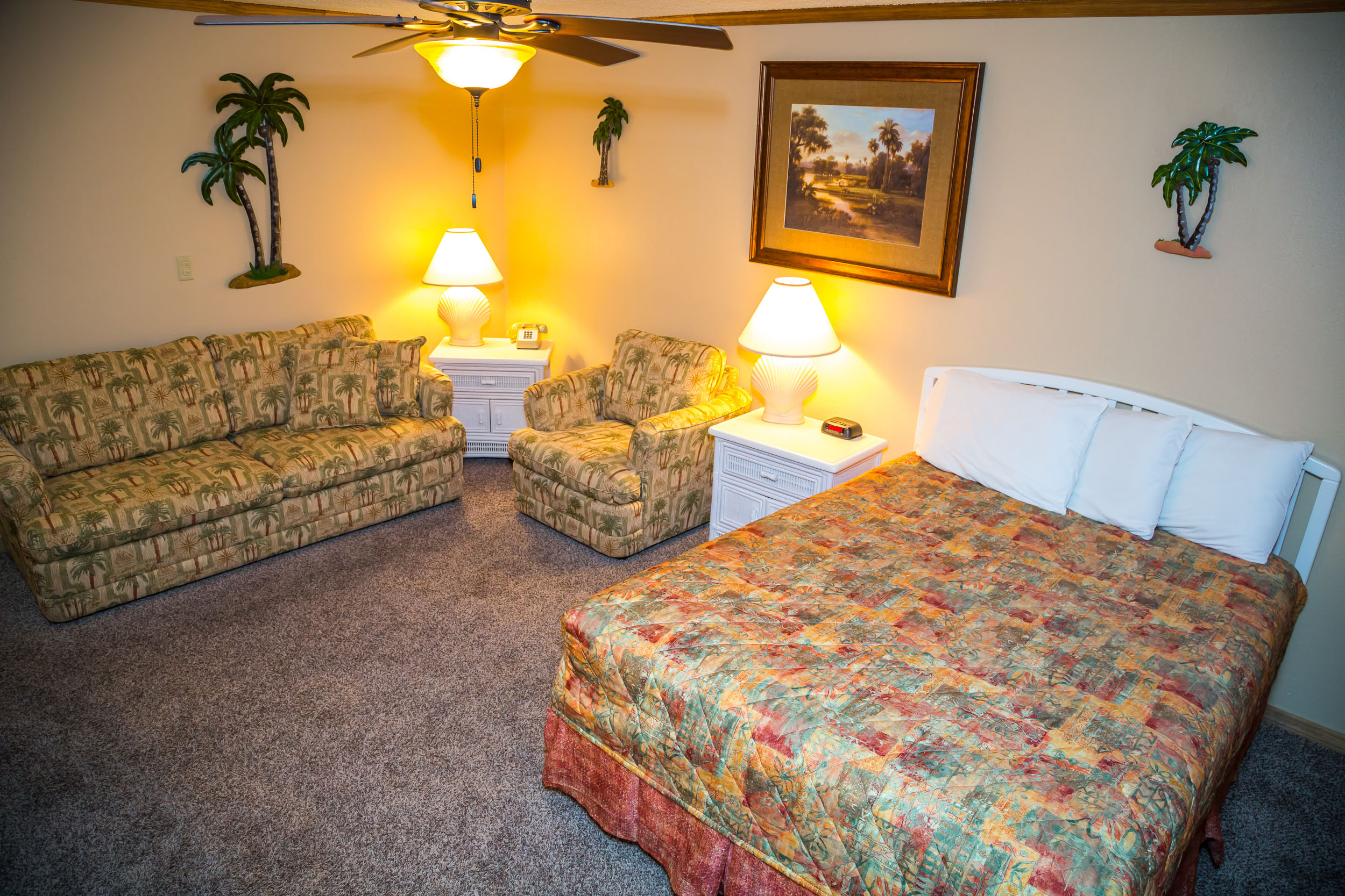 2-Hotel Executive off Ocean photo fo a queen bed and a sleeper couch and easy chair