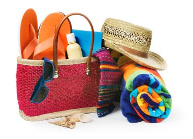 1blogpost Photo pof beach bag and beach supplies - sunglasses, towels, hat, sun tan lotion