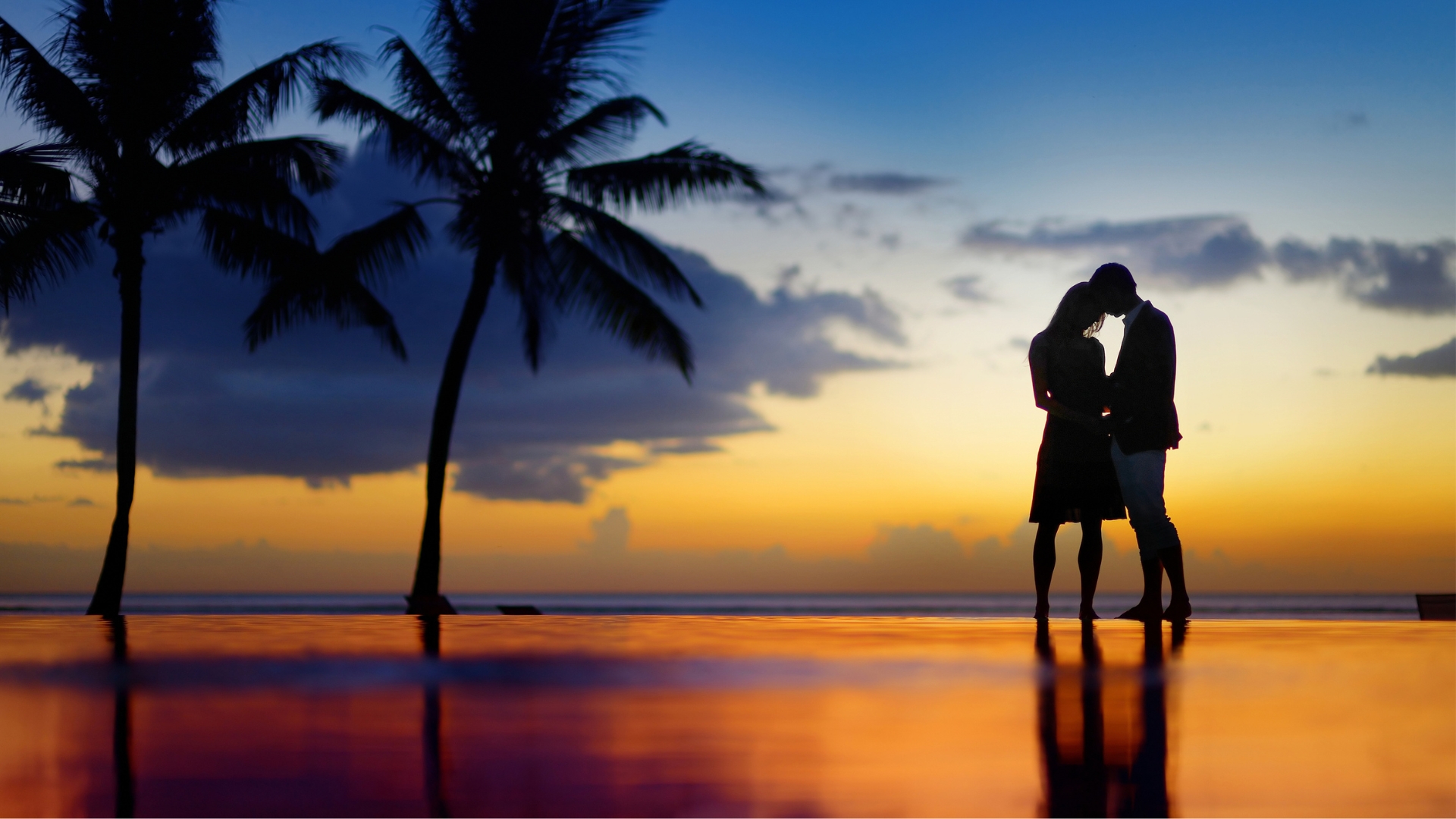 Couple on the beach at sunset