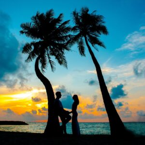 Couple enjoying time together on the beach at sunset