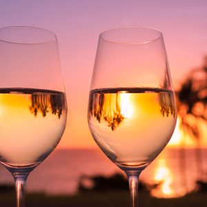 Two glasses of wine at sunset